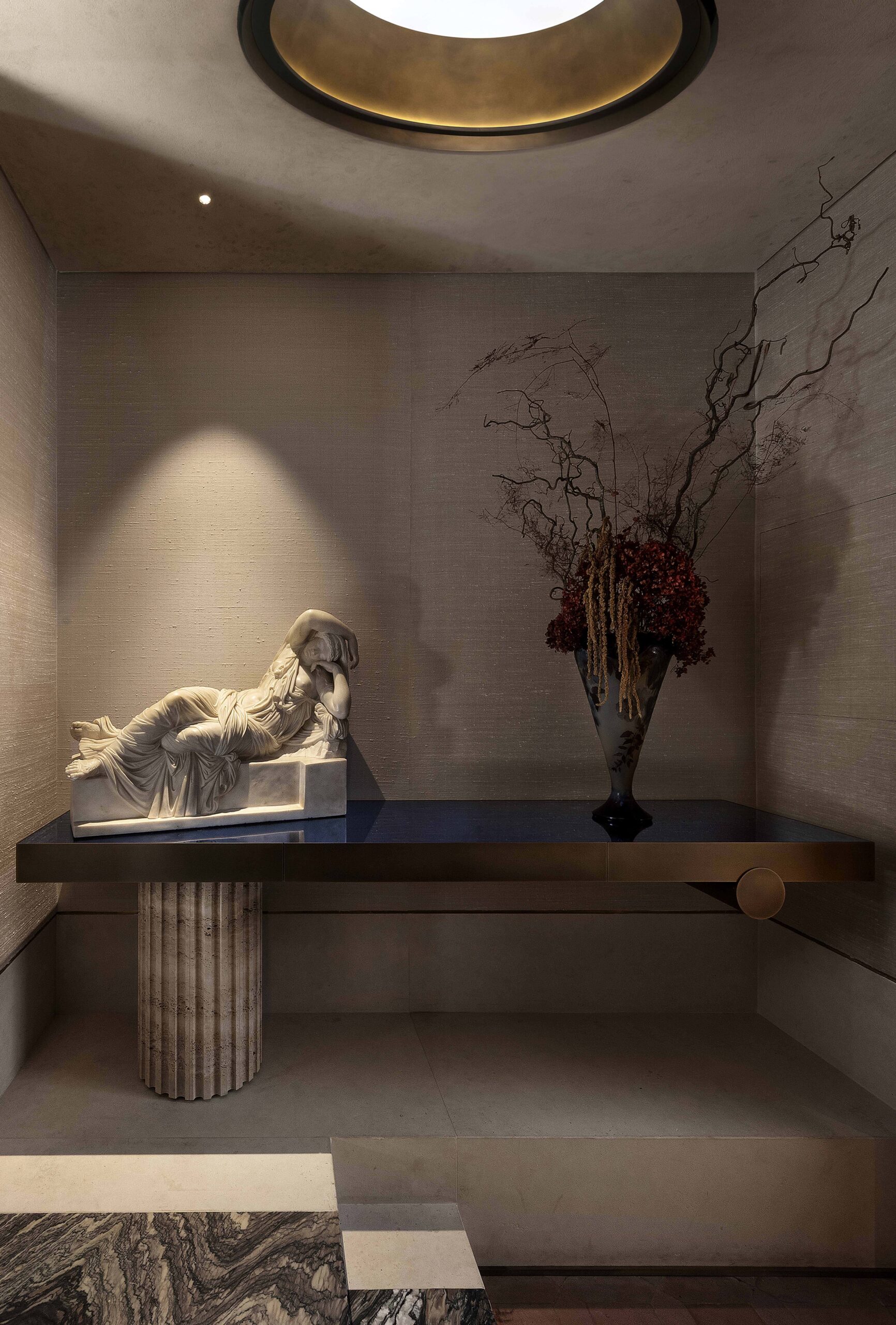 La Grande Bellezza was a historic home interior design project for a 16th-century apartment building in Rome. The image shows a reclining marble statue next to a floral arrangement in contrasting light and dark.